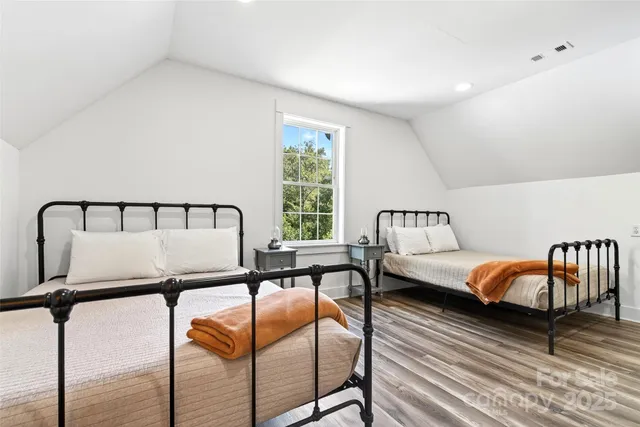 a bedroom with furniture and a window