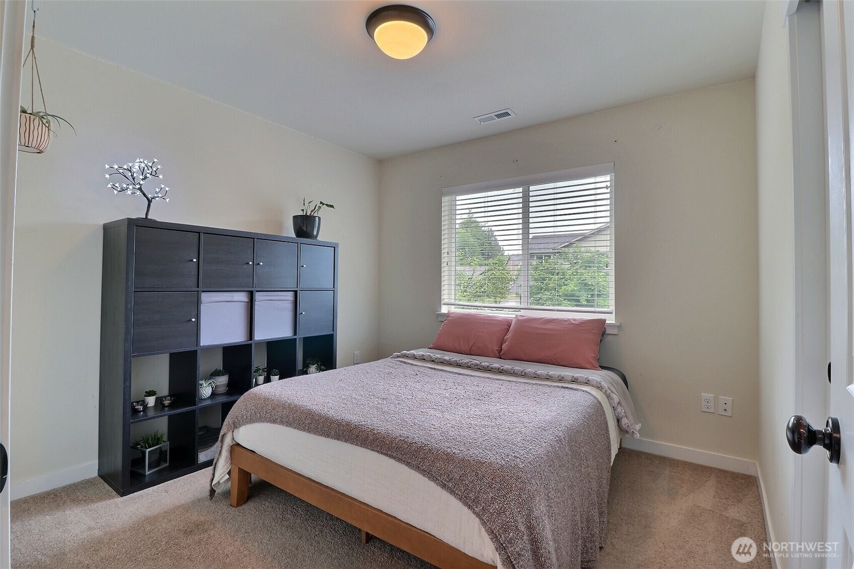 19776 Mountain Ridge Road Southeast Monroe, WA 98272 - Photo 27 of 40 a bedroom with a bed and a window