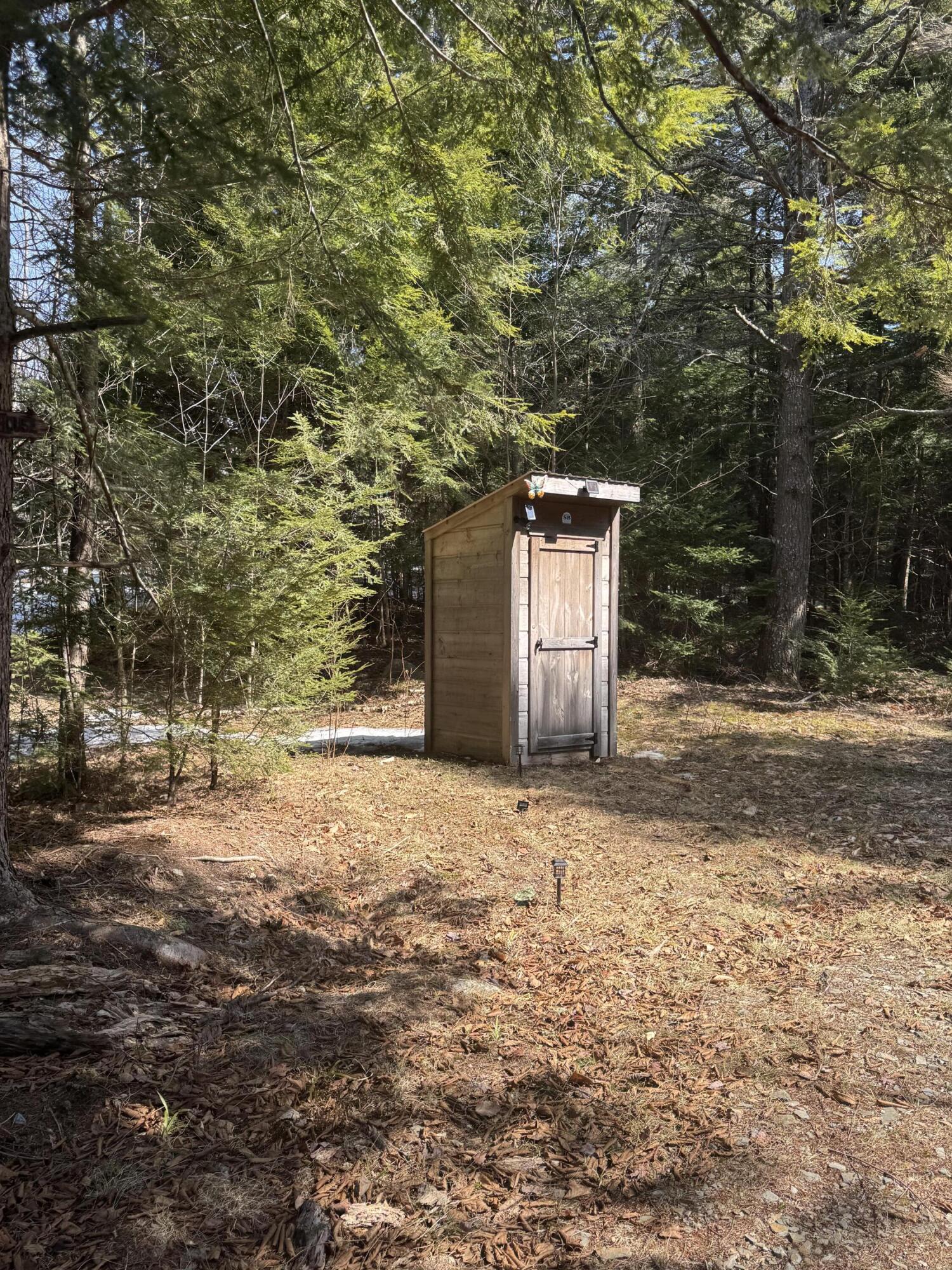 978 Woodville Road Woodville, ME 04457 - Photo 32 of 35 Privy off Driveway