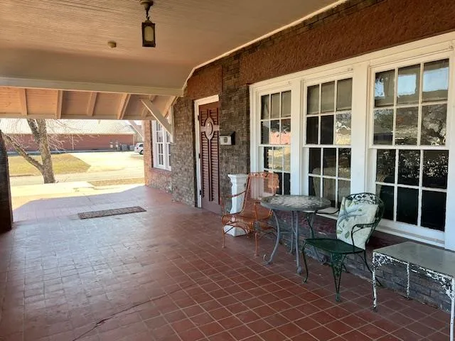 a living room with furniture fireplace and a flat screen tv