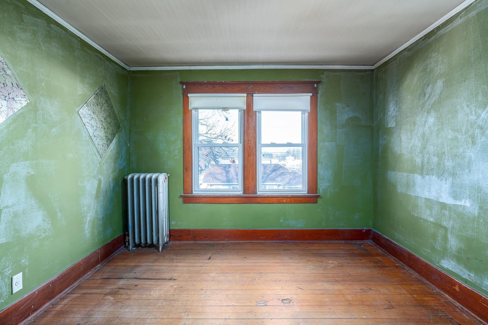 1320 11th Street Rock Island, IL 61201 - Photo 11 of 16 a view of a room with a large window and wooden floor