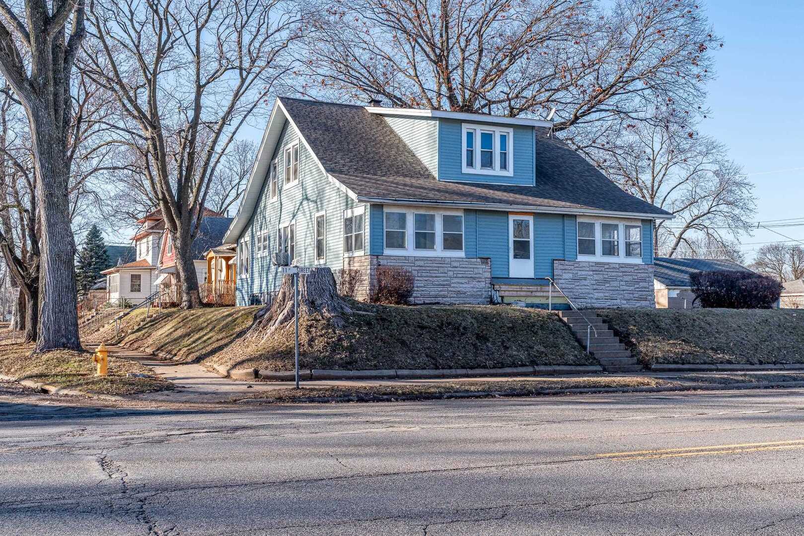1320 11th Street Rock Island, IL 61201 - Photo 2 of 16 a front view of a house with a yard