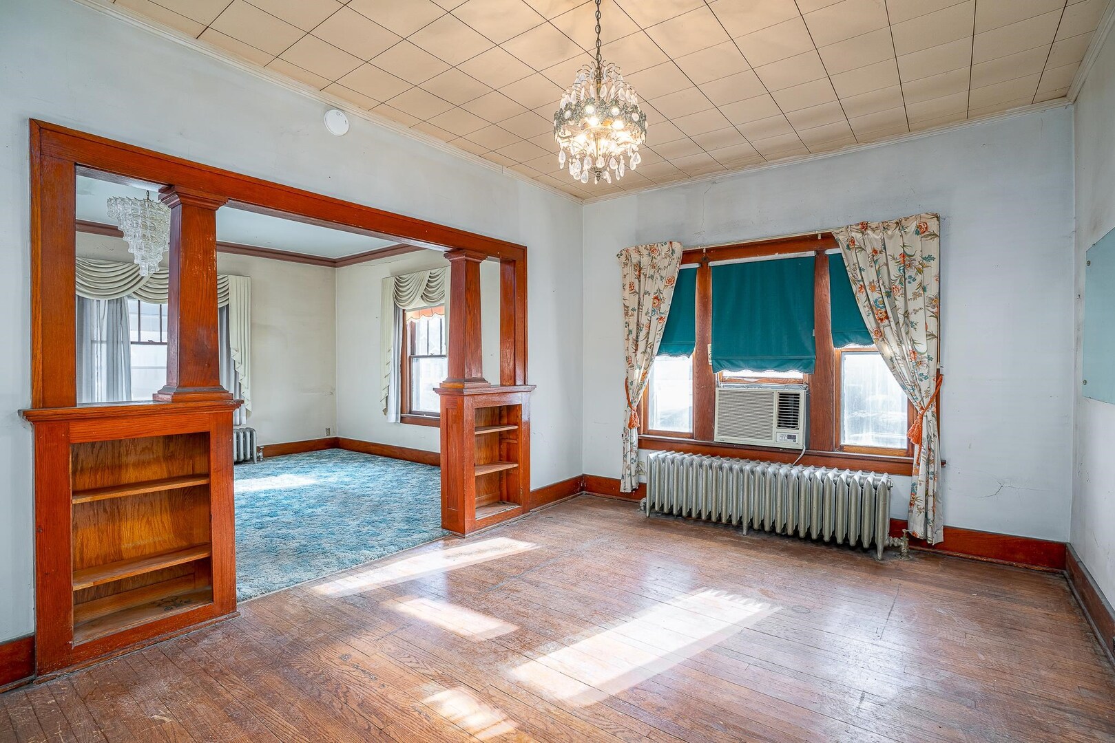 1320 11th Street Rock Island, IL 61201 - Photo 5 of 16 a view of a livingroom with furniture wooden floor and windows