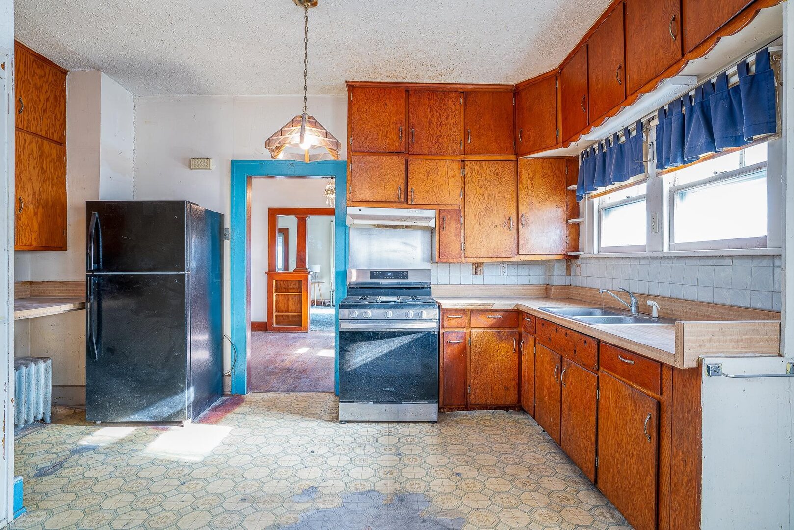1320 11th Street Rock Island, IL 61201 - Photo 6 of 16 a kitchen with stainless steel appliances granite countertop a refrigerator and a sink
