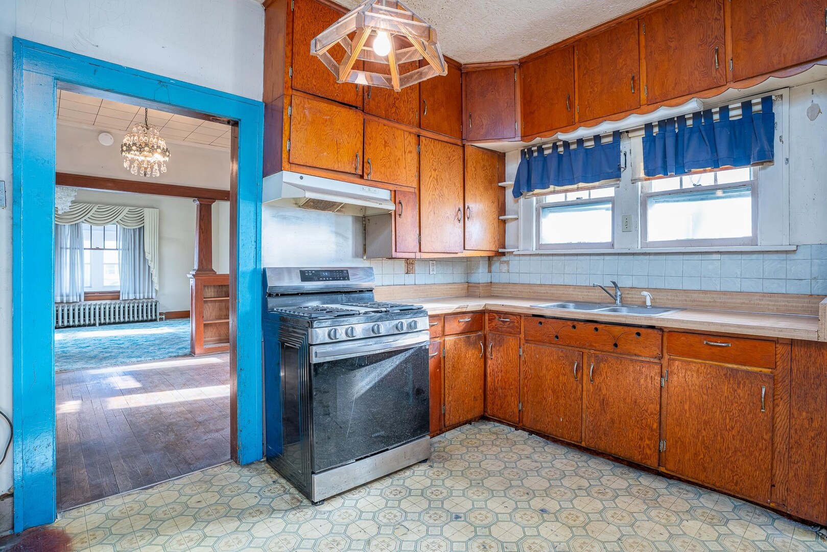 1320 11th Street Rock Island, IL 61201 - Photo 7 of 16 a kitchen with stainless steel appliances granite countertop a sink stove and cabinets
