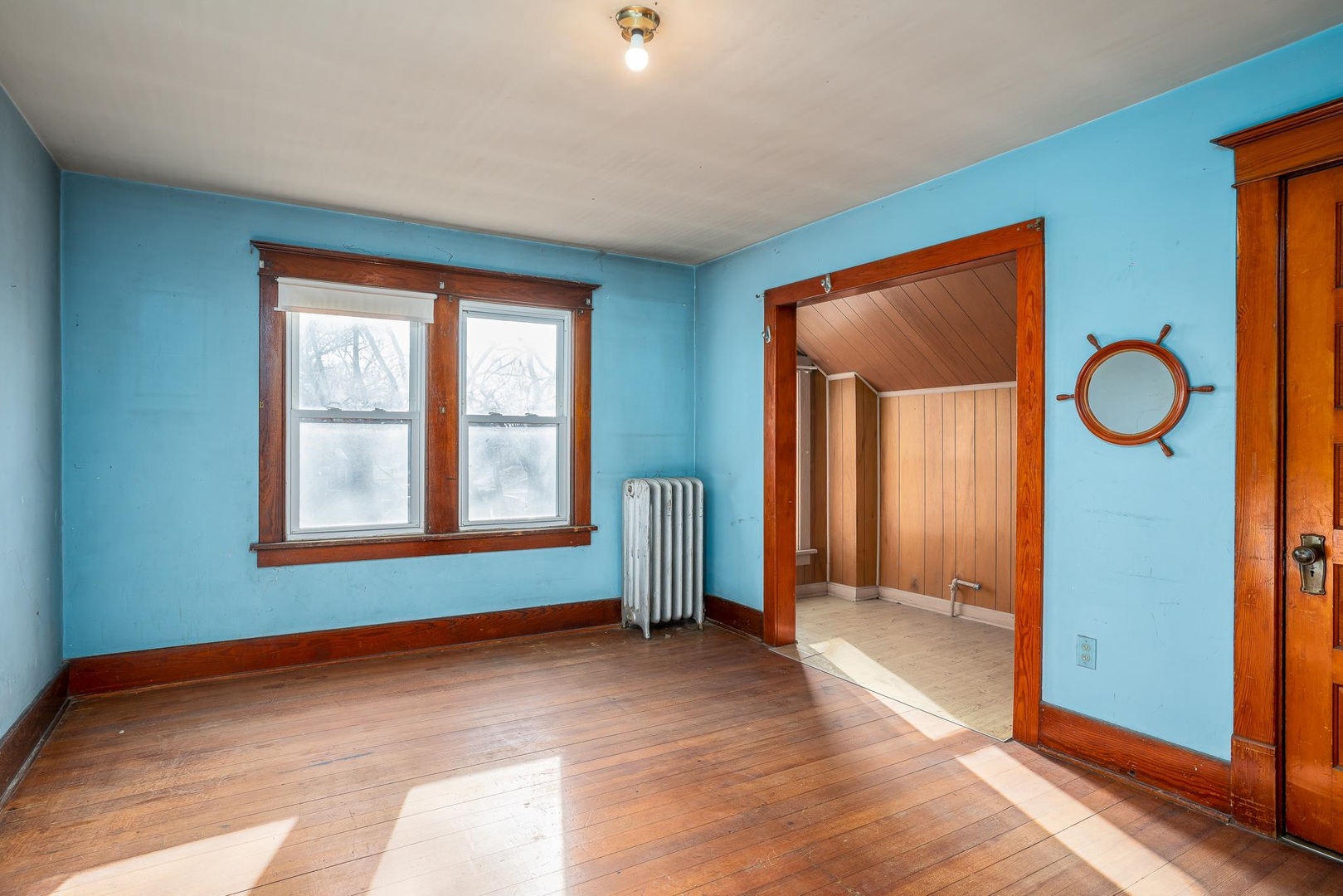 1320 11th Street Rock Island, IL 61201 - Photo 10 of 16 a view of empty room with window and hardwood