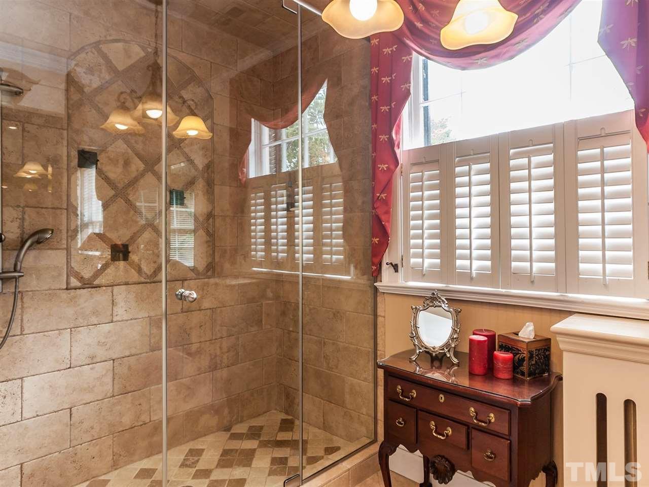 1553 Carr Raleigh, NC 27608 - Photo 14 of 25 a bathroom with a bathtub and shower