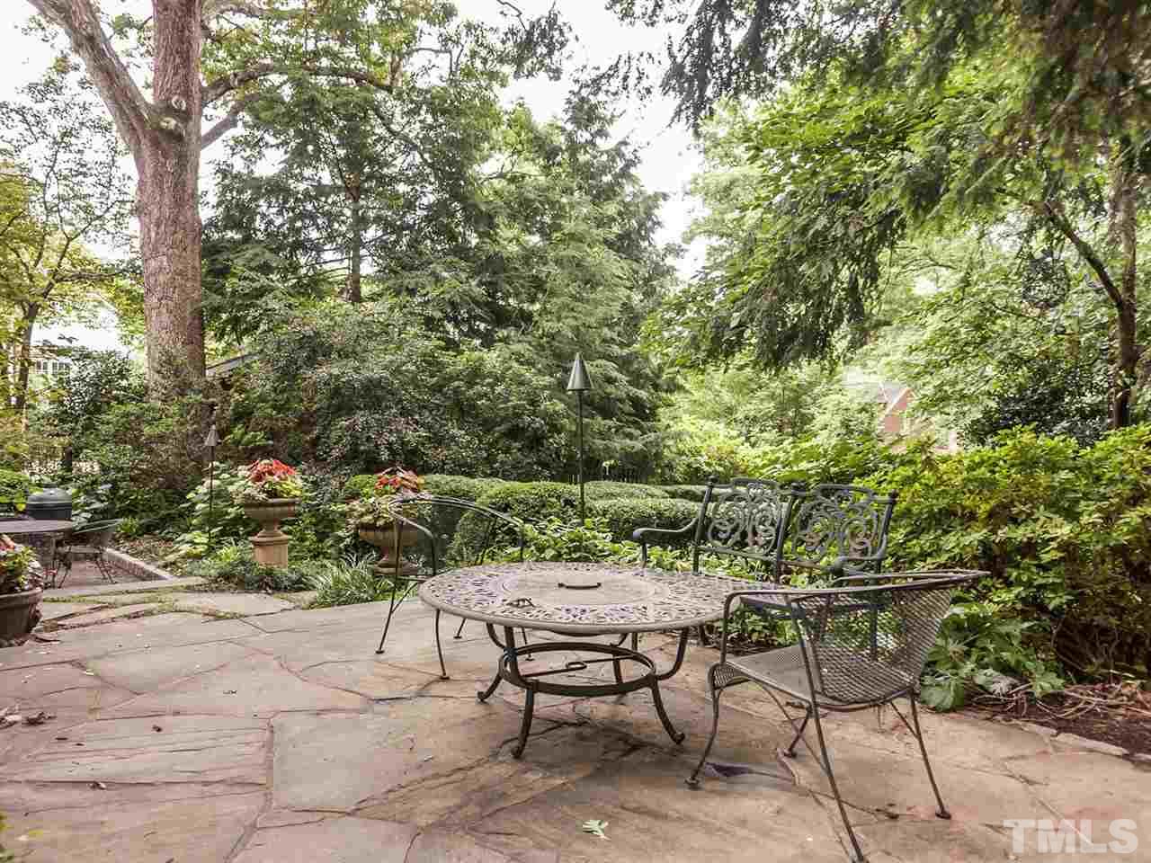 1553 Carr Raleigh, NC 27608 - Photo 22 of 25 a view of a yard with table and chairs
