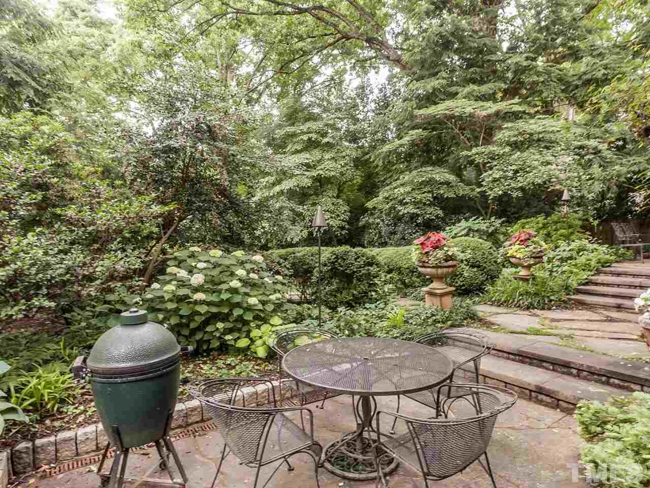 1553 Carr Raleigh, NC 27608 - Photo 23 of 25 a view of a backyard with plants and chairs