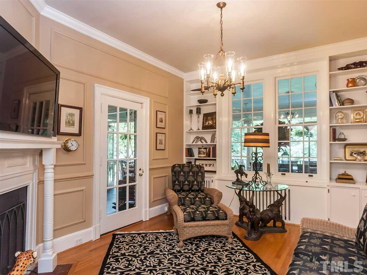 1553 Carr Raleigh, NC 27608 - Photo 7 of 25 a room with furniture and a chandelier