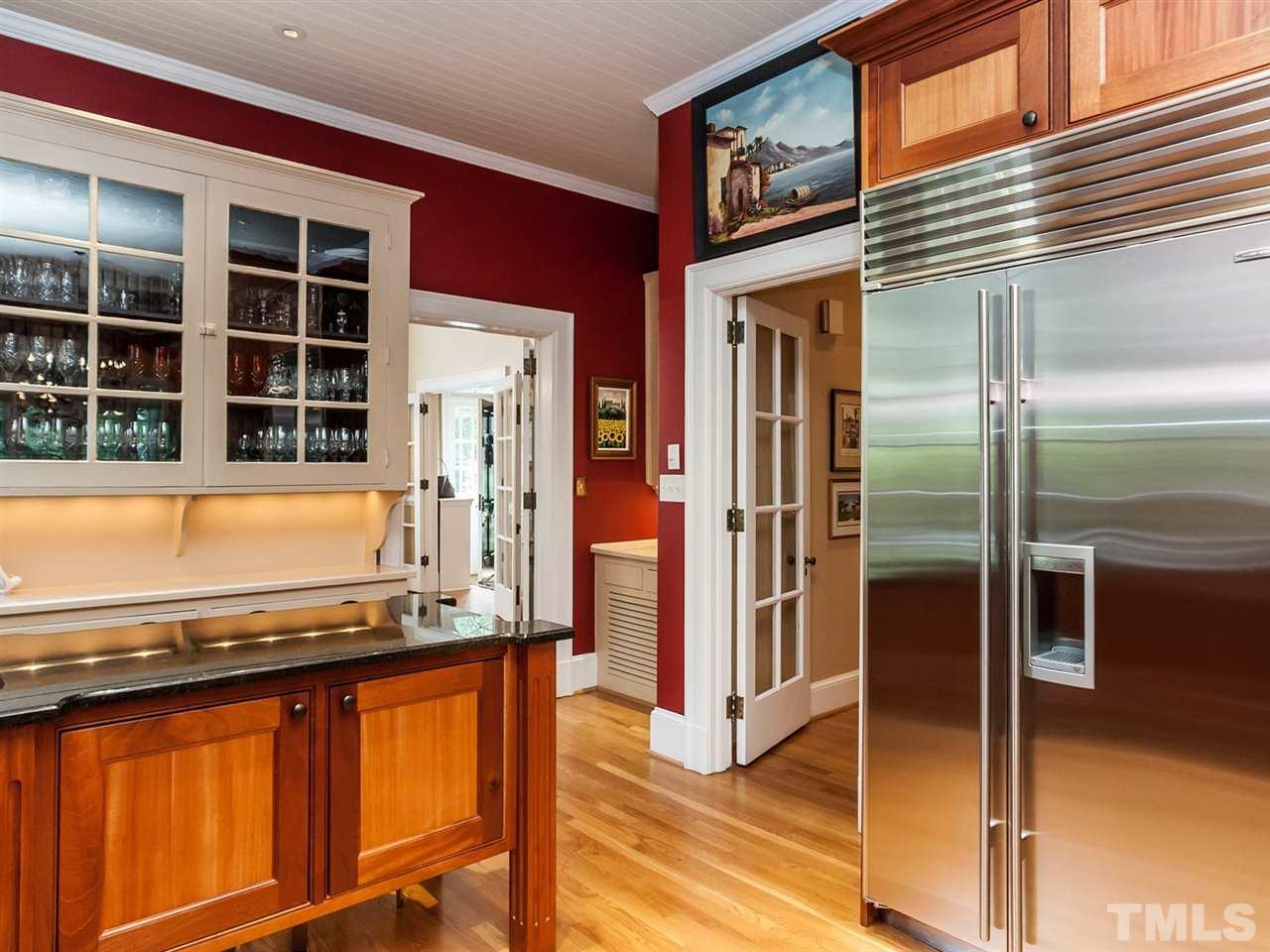 1553 Carr Raleigh, NC 27608 - Photo 9 of 25 a view of a balcony with refrigerator and wooden floor