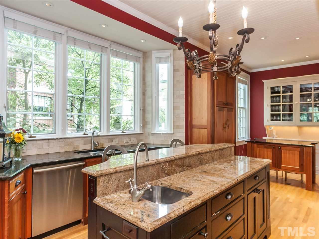 1553 Carr Raleigh, NC 27608 - Photo 10 of 25 a kitchen with a sink and large windows