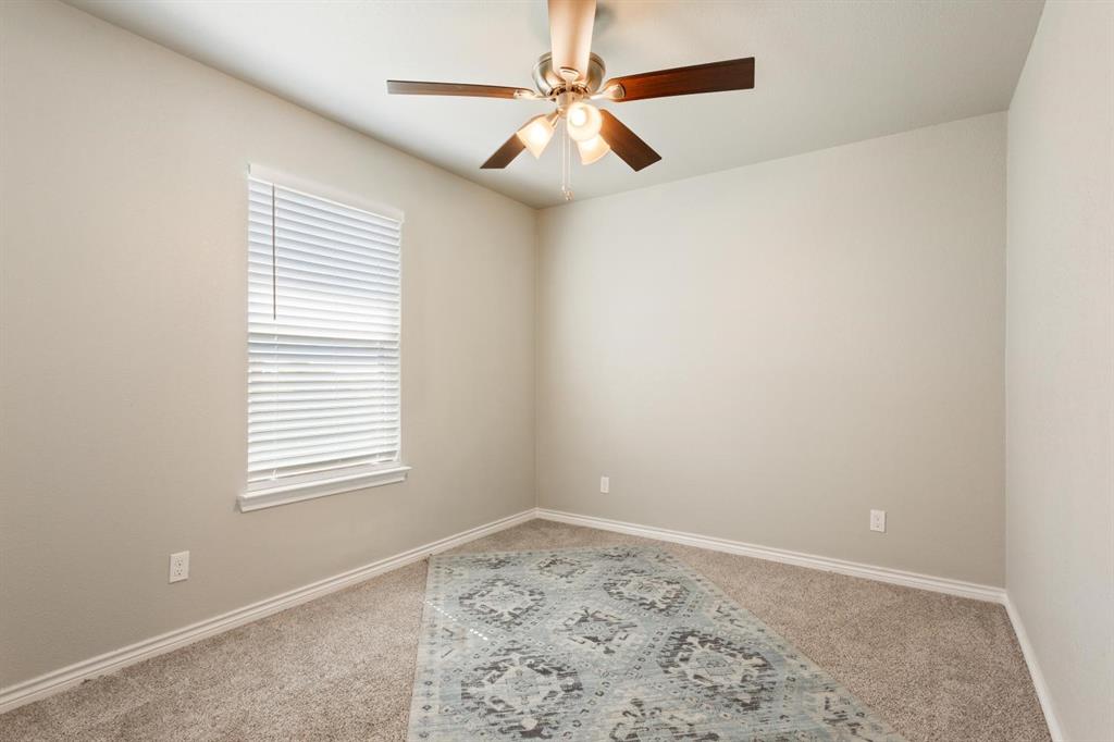 8876 1237 Spur Troy, TX 76579 - Photo 24 of 31 an empty room with a window and a fan