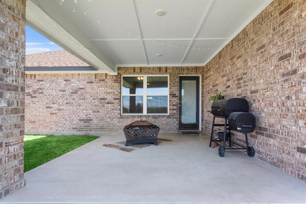 8876 1237 Spur Troy, TX 76579 - Photo 25 of 31 a front view of a house with patio
