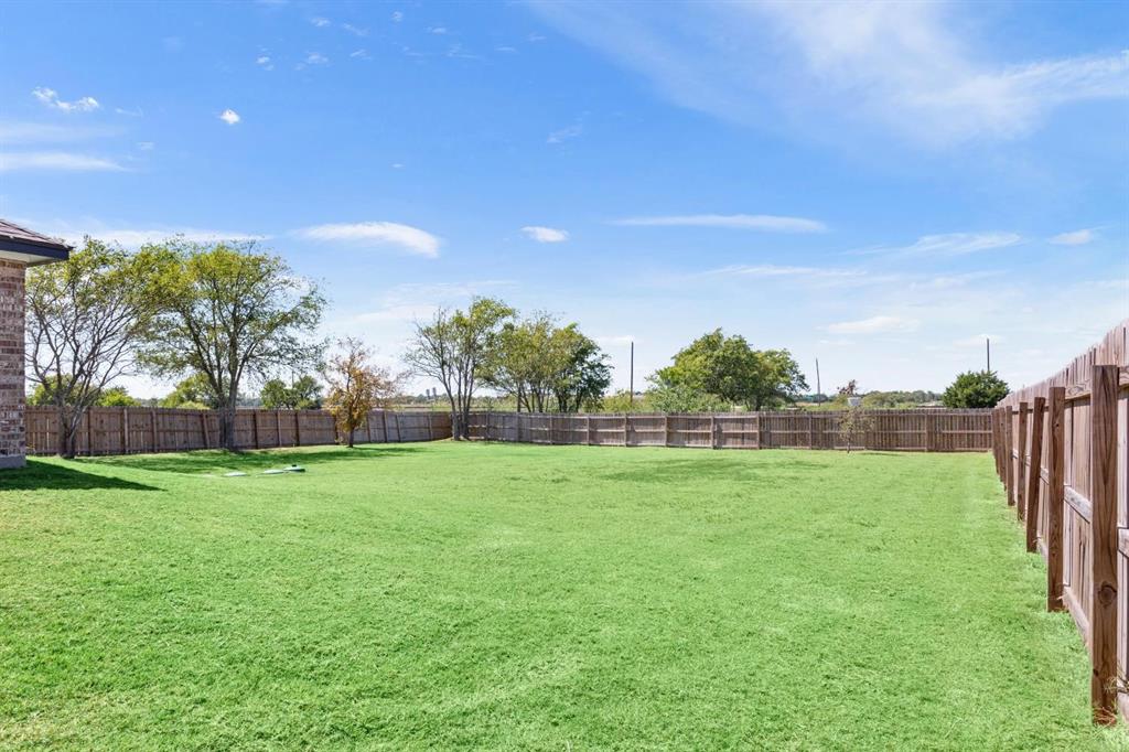 8876 1237 Spur Troy, TX 76579 - Photo 27 of 31 a view of field with tall trees