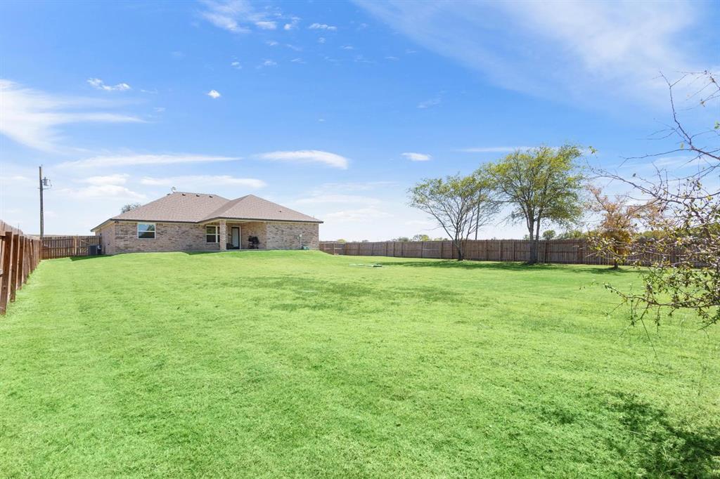 8876 1237 Spur Troy, TX 76579 - Photo 28 of 31 a view of house with a big yard