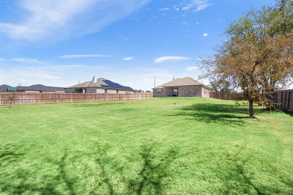 8876 1237 Spur Troy, TX 76579 - Photo 29 of 31 a view of a house with a big yard and large trees