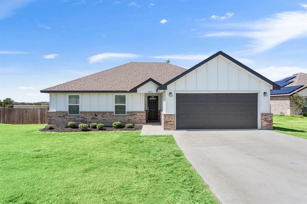 8876 1237 Spur Troy, TX 76579 - Photo 5 of 31 a front view of house with yard and garage