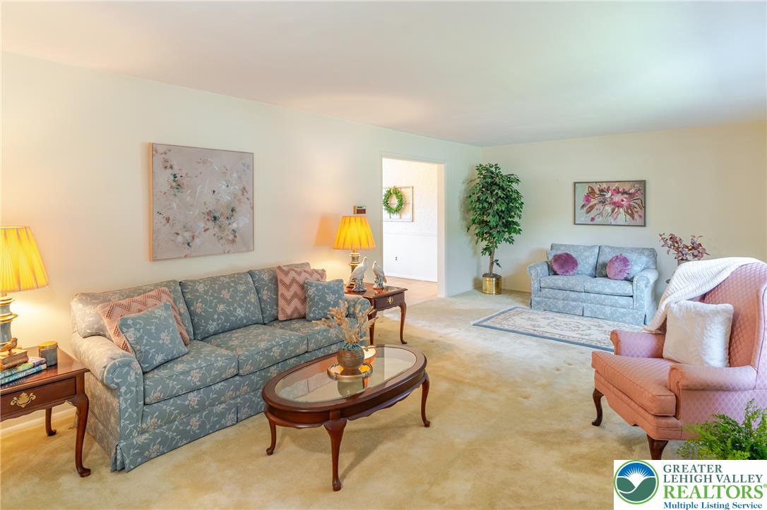 2130 Wisteria Road Lower Macungie Township, PA 18062 - Photo 7 of 48 Large, well-lit living room at the front of the home.