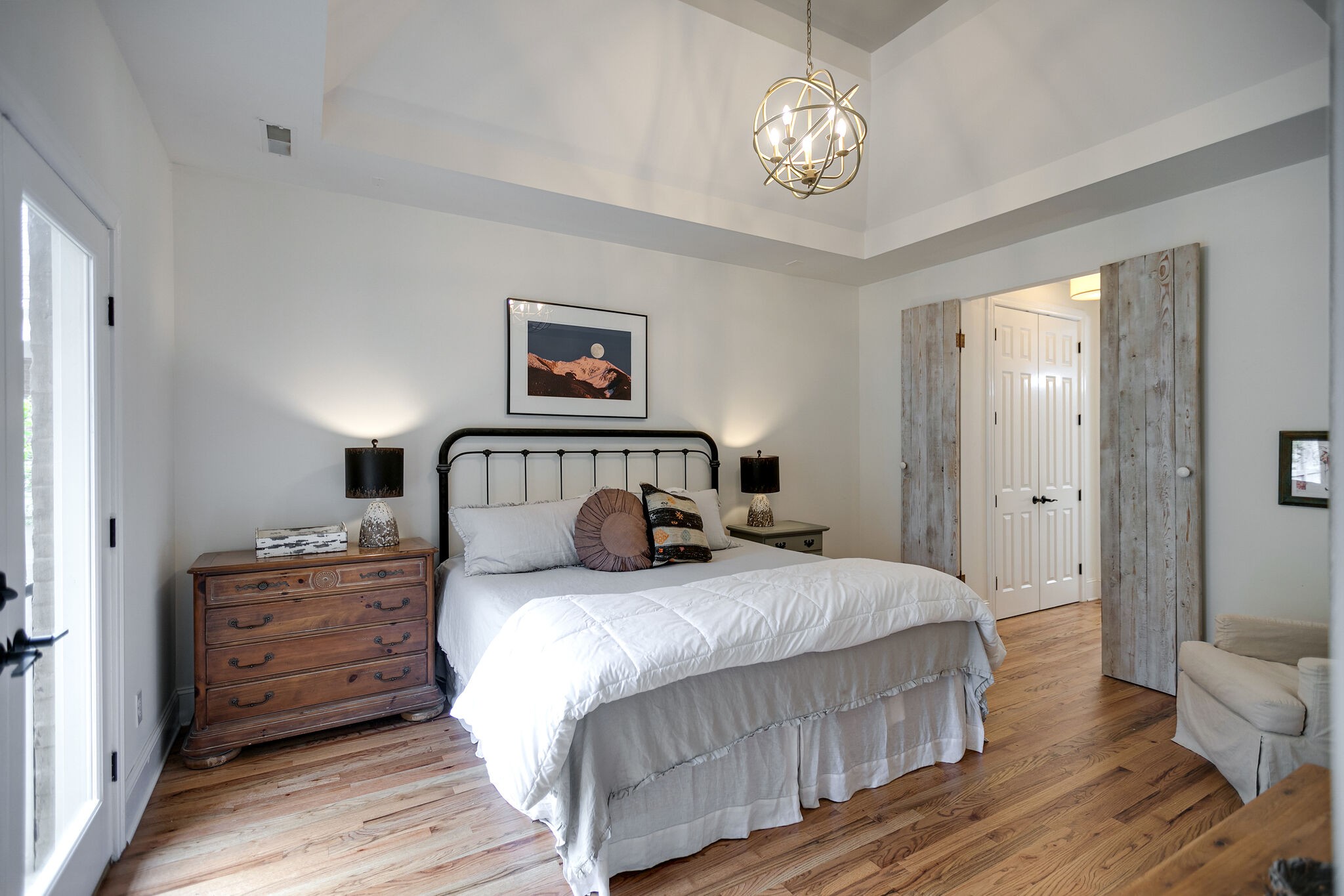 126 Addison Avenue Franklin, TN 37064 - Photo 21 of 38 a bedroom with a bed and a chandelier