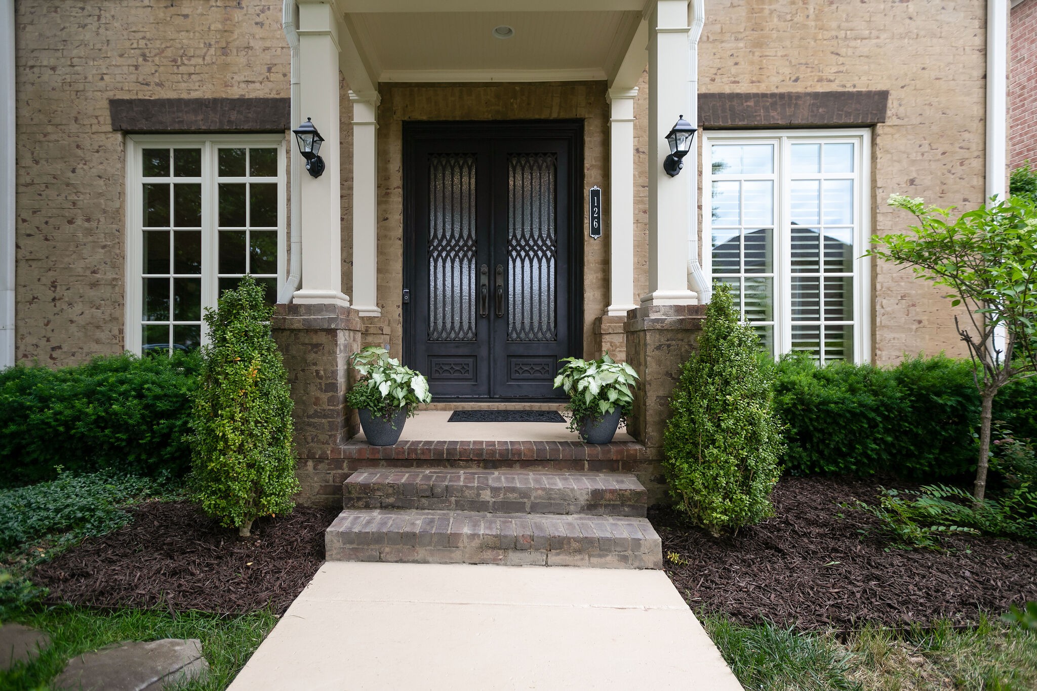 126 Addison Avenue Franklin, TN 37064 - Photo 3 of 38 a view of a house with potted plants
