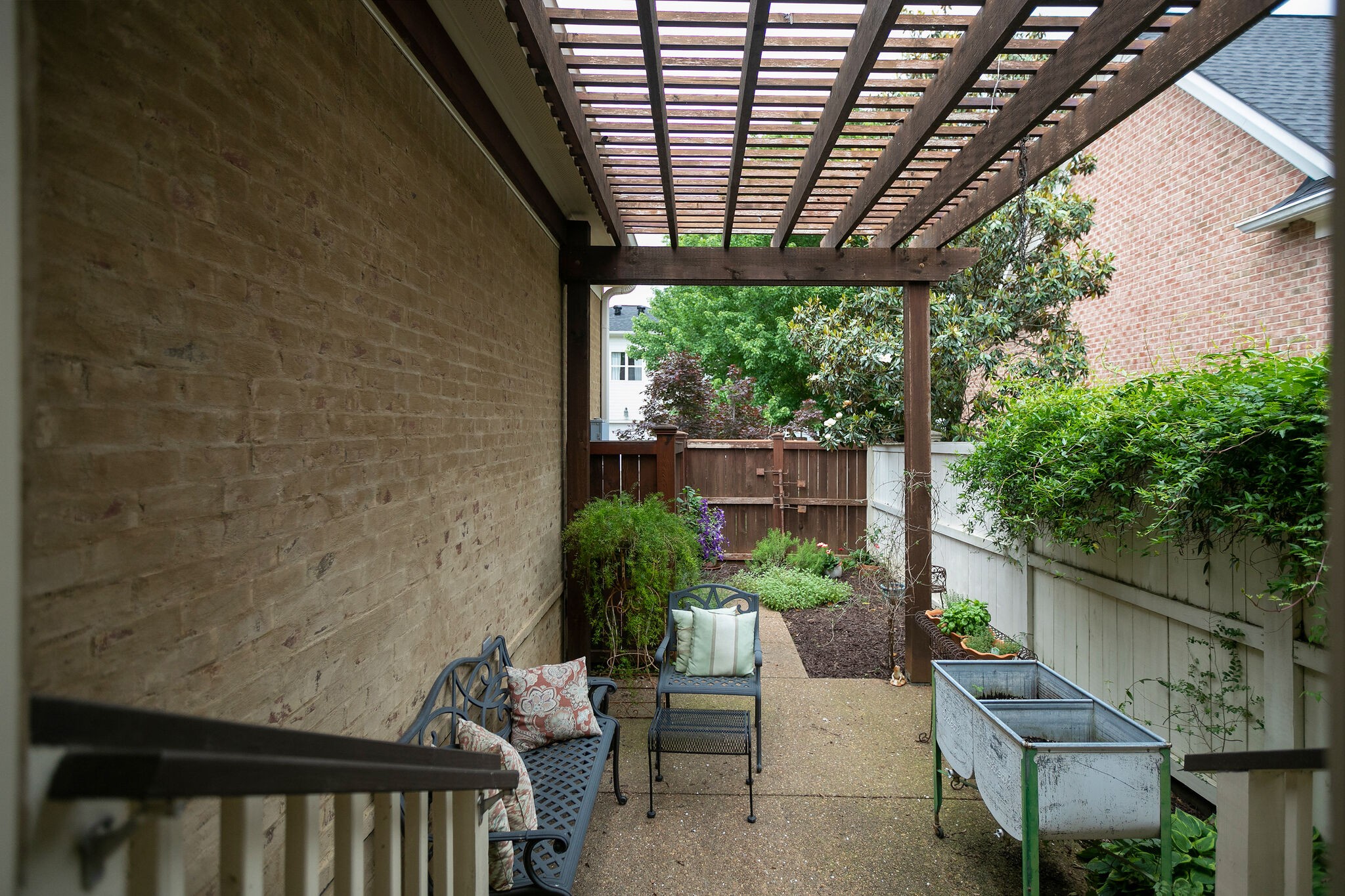126 Addison Avenue Franklin, TN 37064 - Photo 35 of 38 a backyard of a house with a garden and outdoor seating