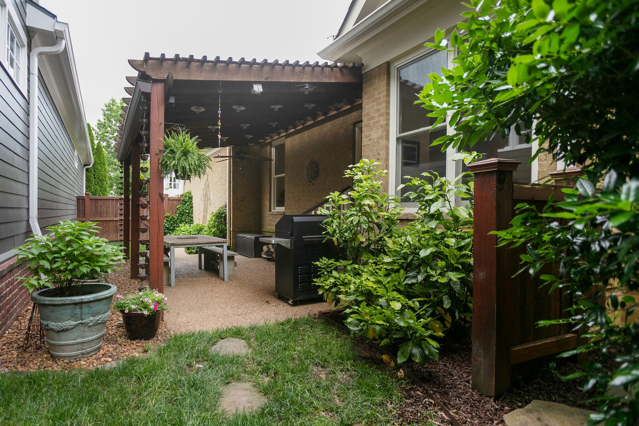 126 Addison Avenue Franklin, TN 37064 - Photo 37 of 38 a garden with plants and outdoor seating