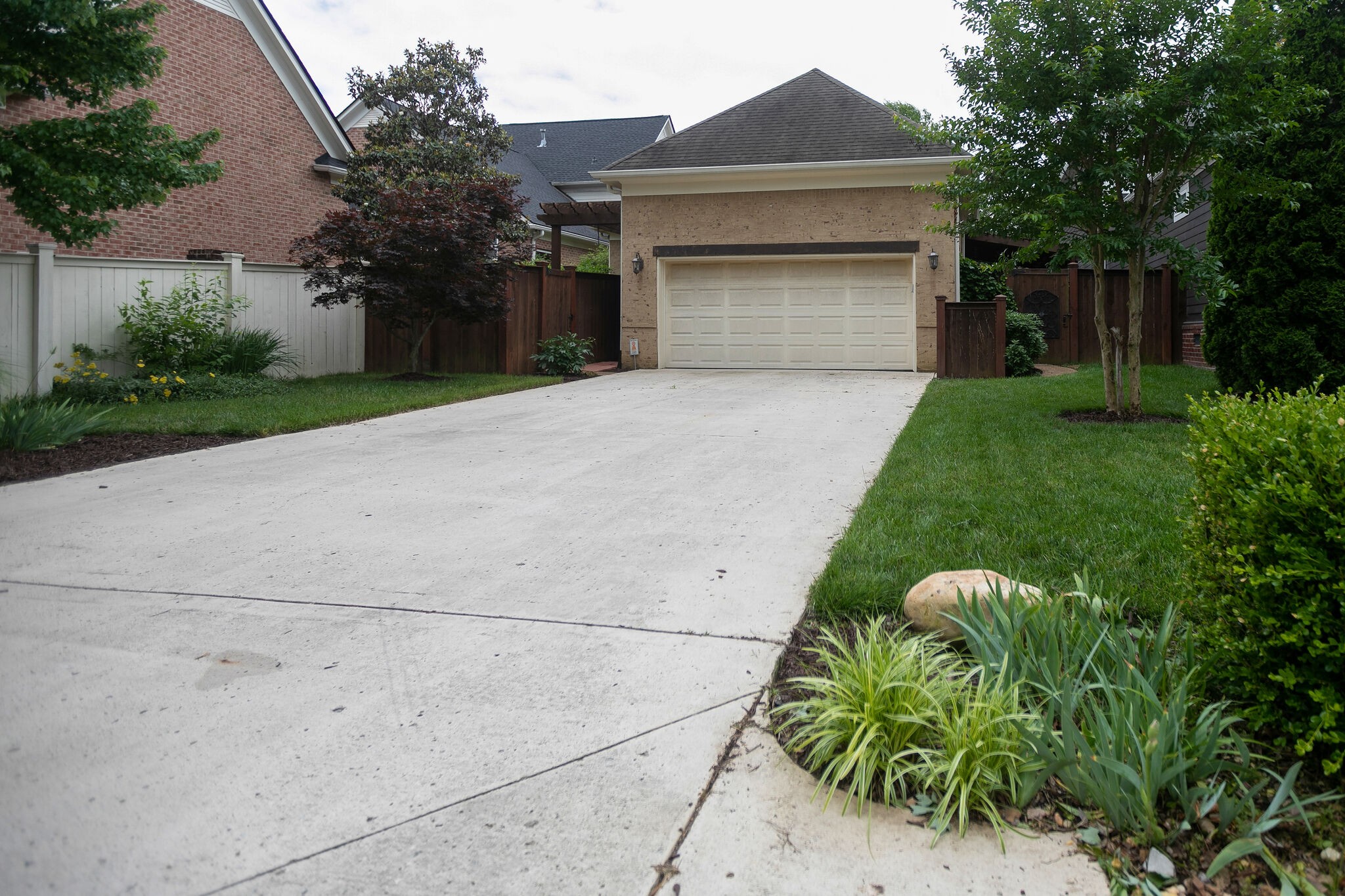 126 Addison Avenue Franklin, TN 37064 - Photo 38 of 38 a front view of a house with a garden and trees