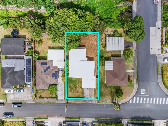 an aerial view of residential houses with outdoor space