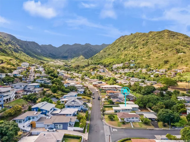 a view of a city with mountains in the background