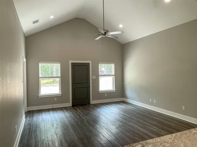 a view of kitchen with wooden floor and window