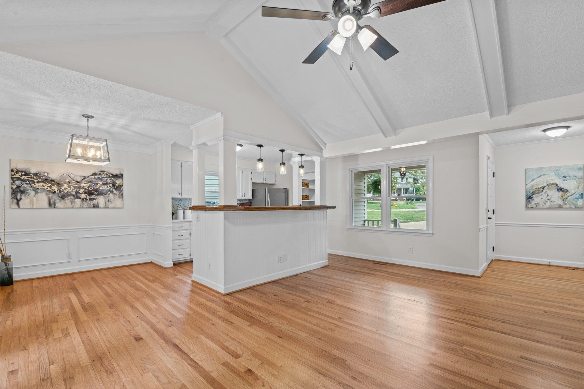 7321 Ridge Grove Court Raleigh, NC 27615 - Photo 32 of 33 Family Room, Kitchen and Dining with Beautifully Refinished Hardwood Flooring. Open Floor Plan