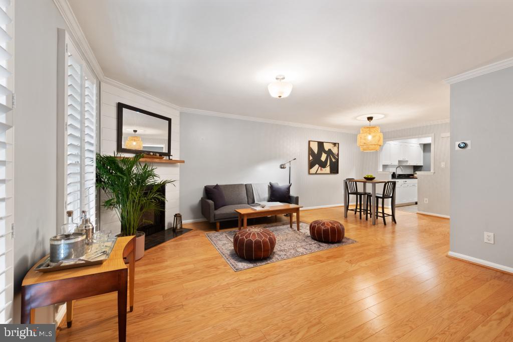 1441 A Street Northeast, Unit 1441 Washington, DC 20002 - Photo 3 of 11 a living room with furniture and a table