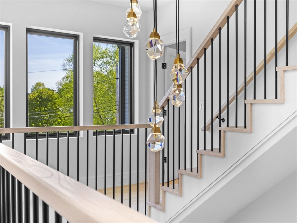 54 Redwood Road Newton, MA 02459 - Photo 25 of 42 a view of staircase with lots of windows and white walls