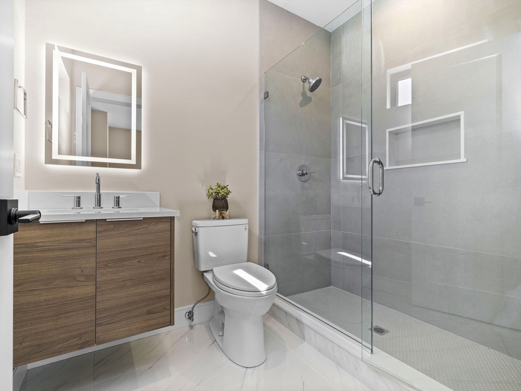 54 Redwood Road Newton, MA 02459 - Photo 32 of 42 a bathroom with a toilet sink and shower