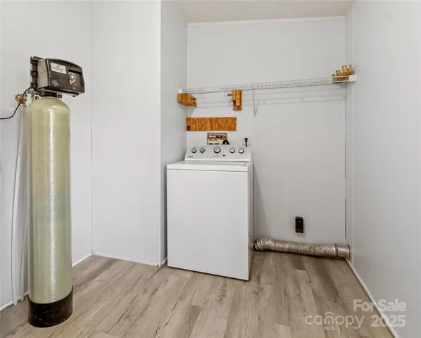a view of a storage and utility room with washer and dryer
