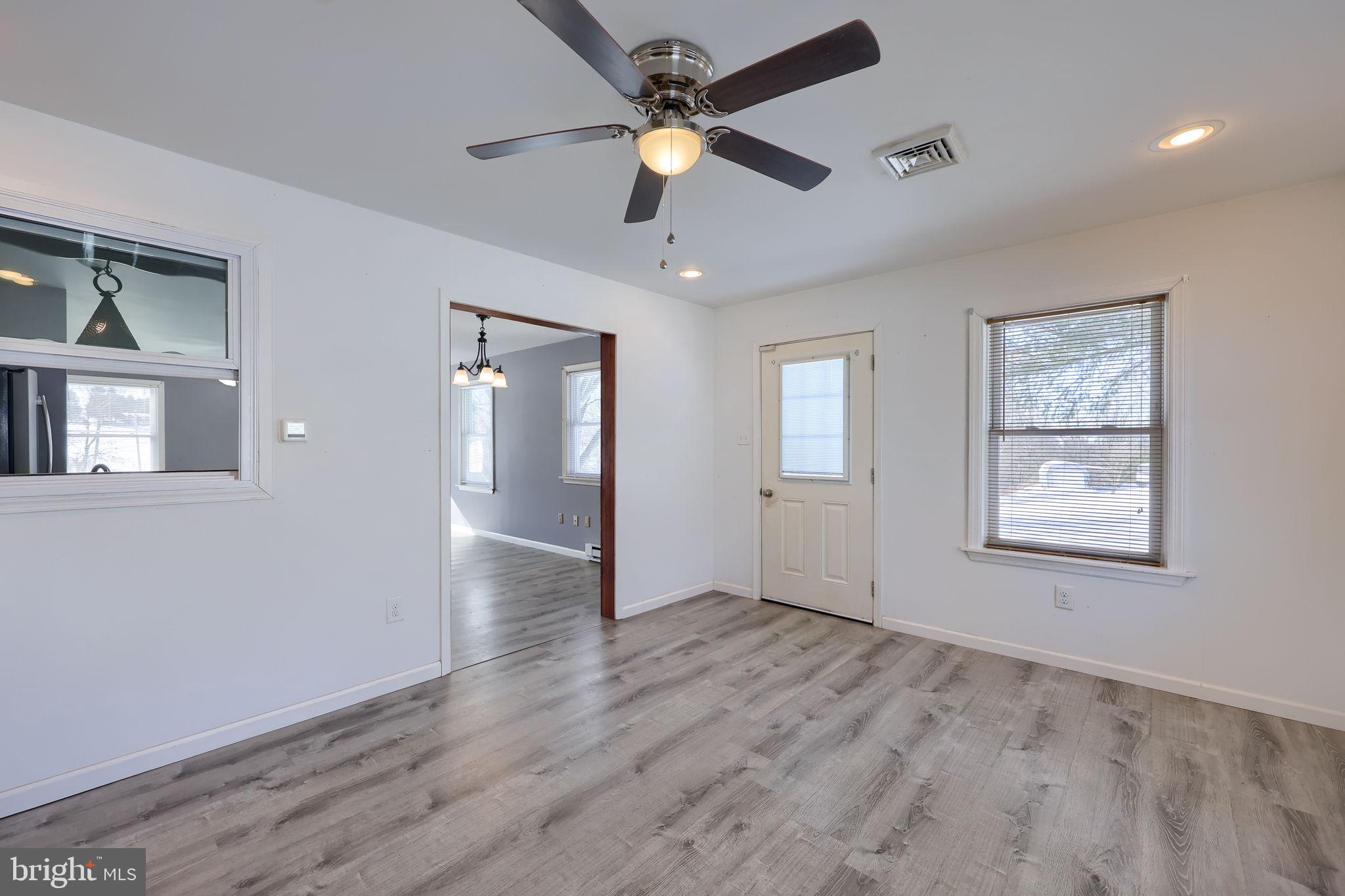 877 Richmond Road Windsor, PA 17366 - Photo 17 of 40 a view of an empty room with window and wooden floor