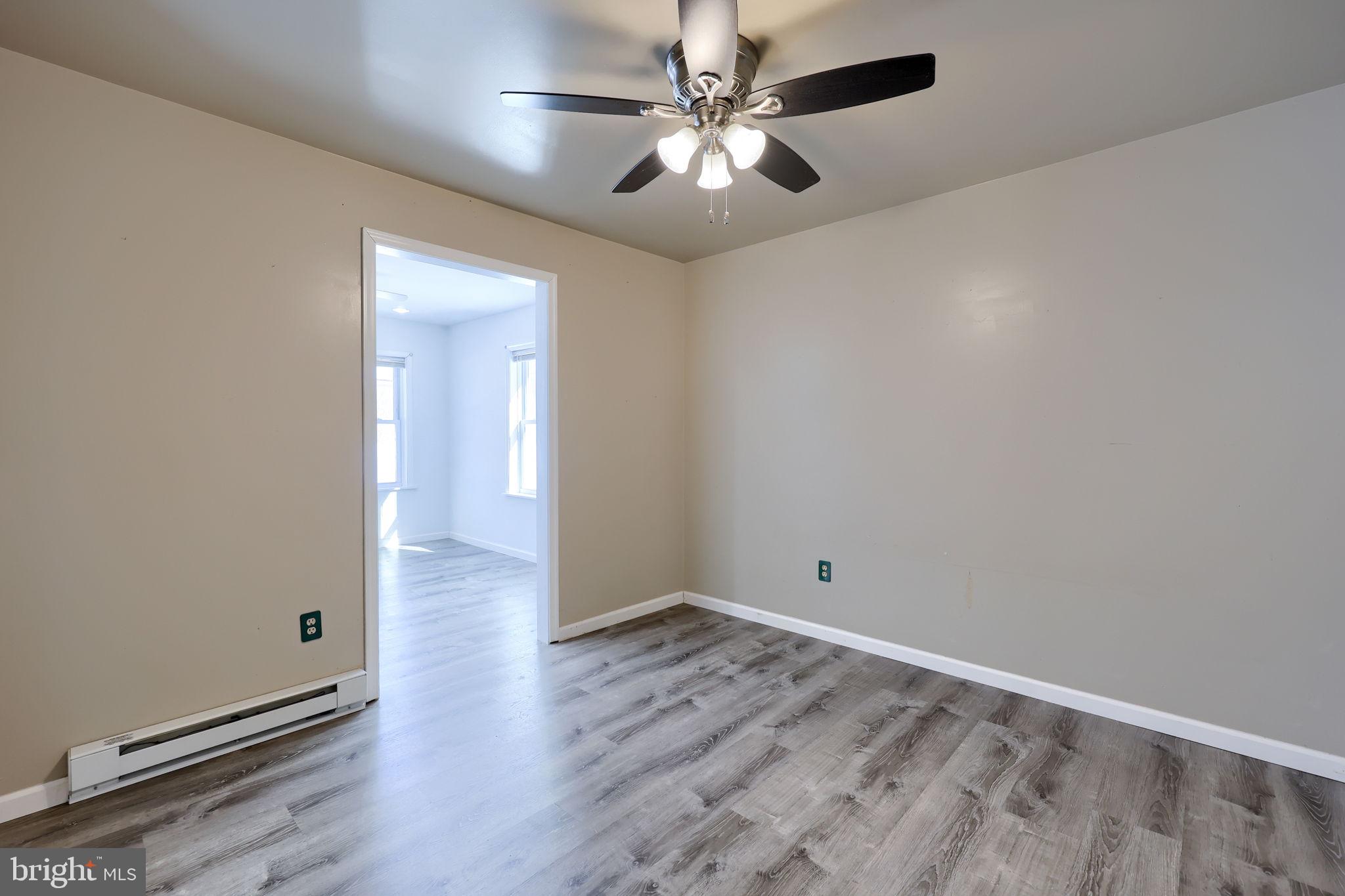 877 Richmond Road Windsor, PA 17366 - Photo 20 of 40 an empty room with wooden floor and fan