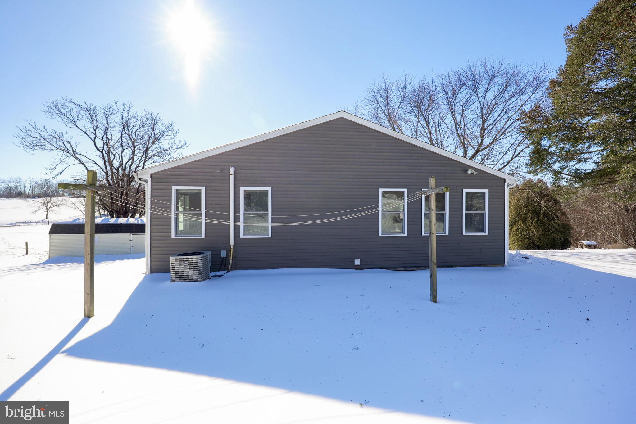 877 Richmond Road Windsor, PA 17366 - Photo 35 of 40 a backyard of a house with yard and iron fence