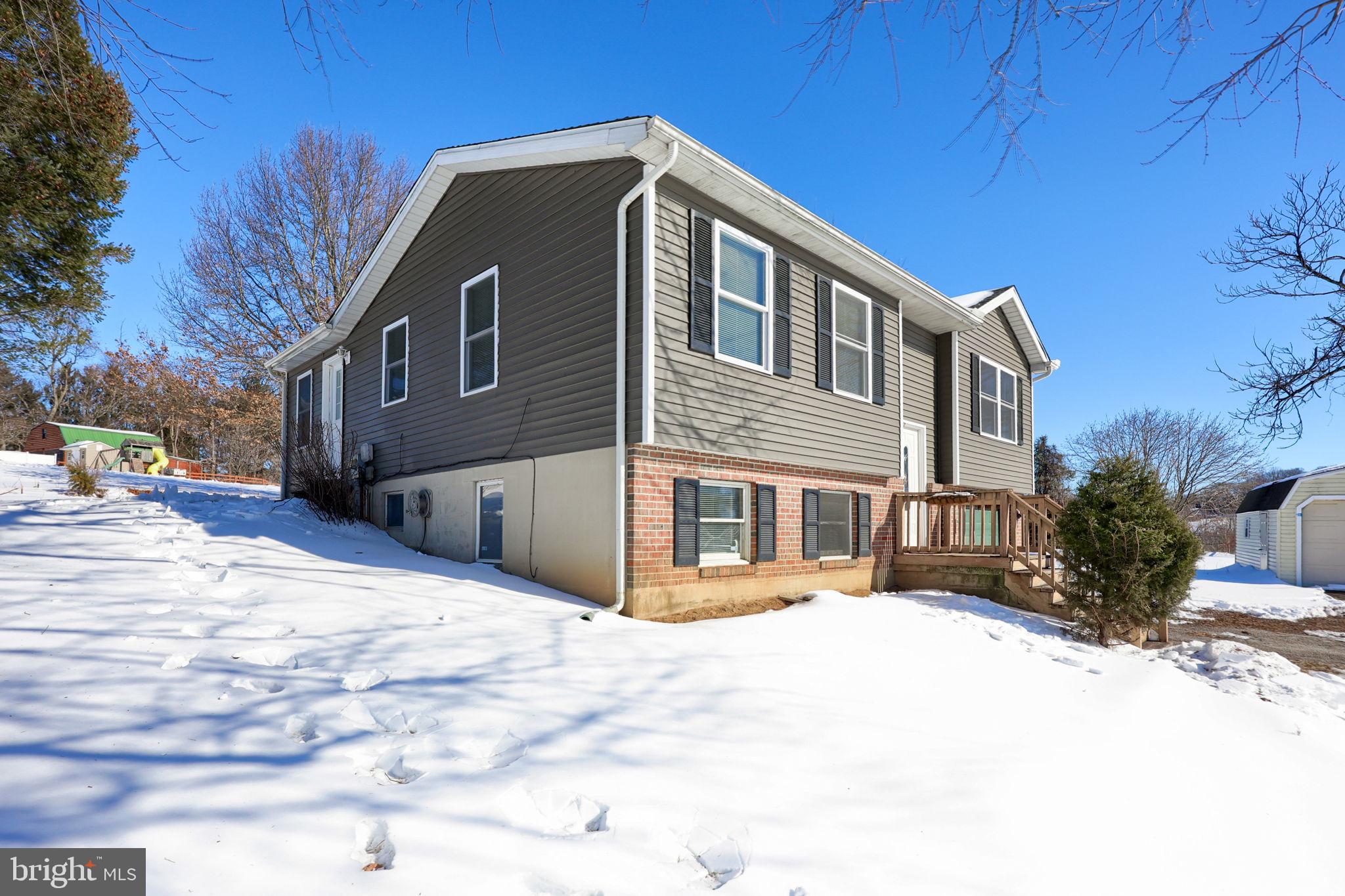877 Richmond Road Windsor, PA 17366 - Photo 4 of 40 a front view of a house with a yard