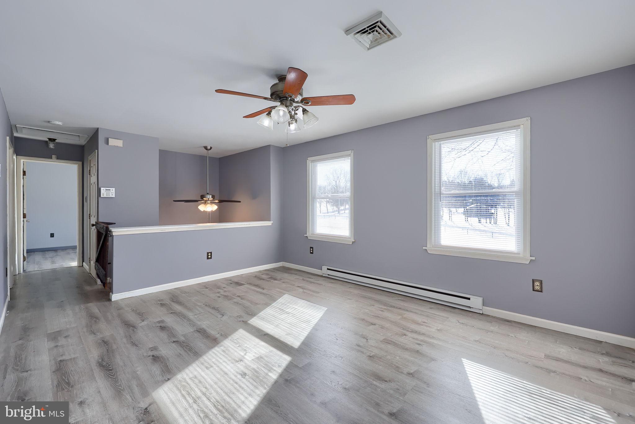 877 Richmond Road Windsor, PA 17366 - Photo 7 of 40 a view of an empty room with a window and wooden floor