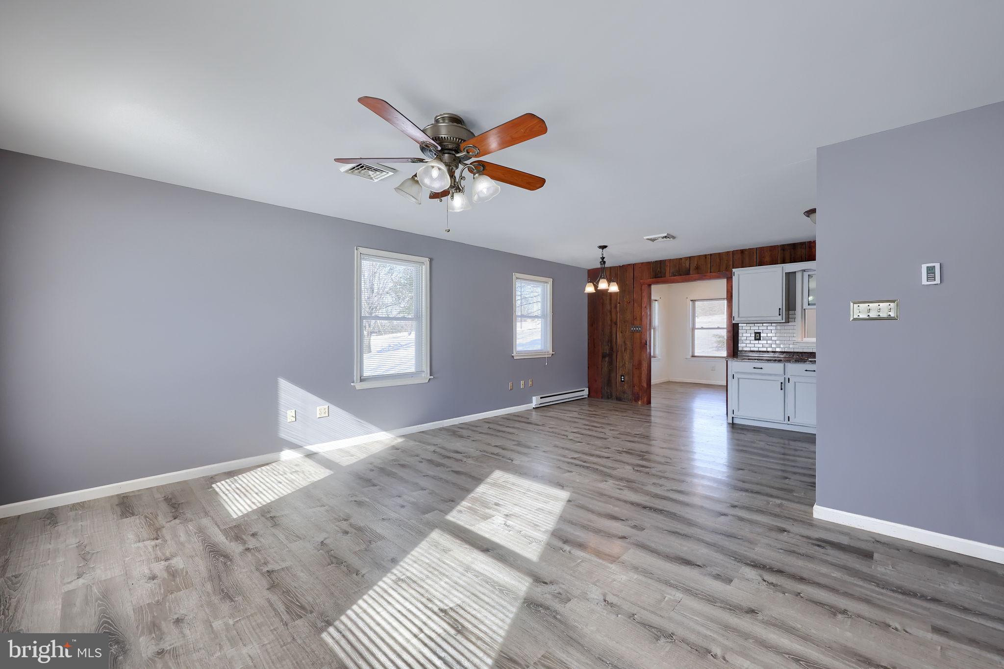 877 Richmond Road Windsor, PA 17366 - Photo 9 of 40 a view of an empty room with window and wooden floor