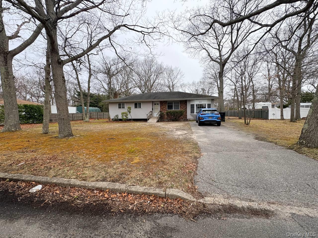 66 40th Street Islip, NY 11751 - Photo 1 of 12 a view of a house with a yard covered with snow in front of house