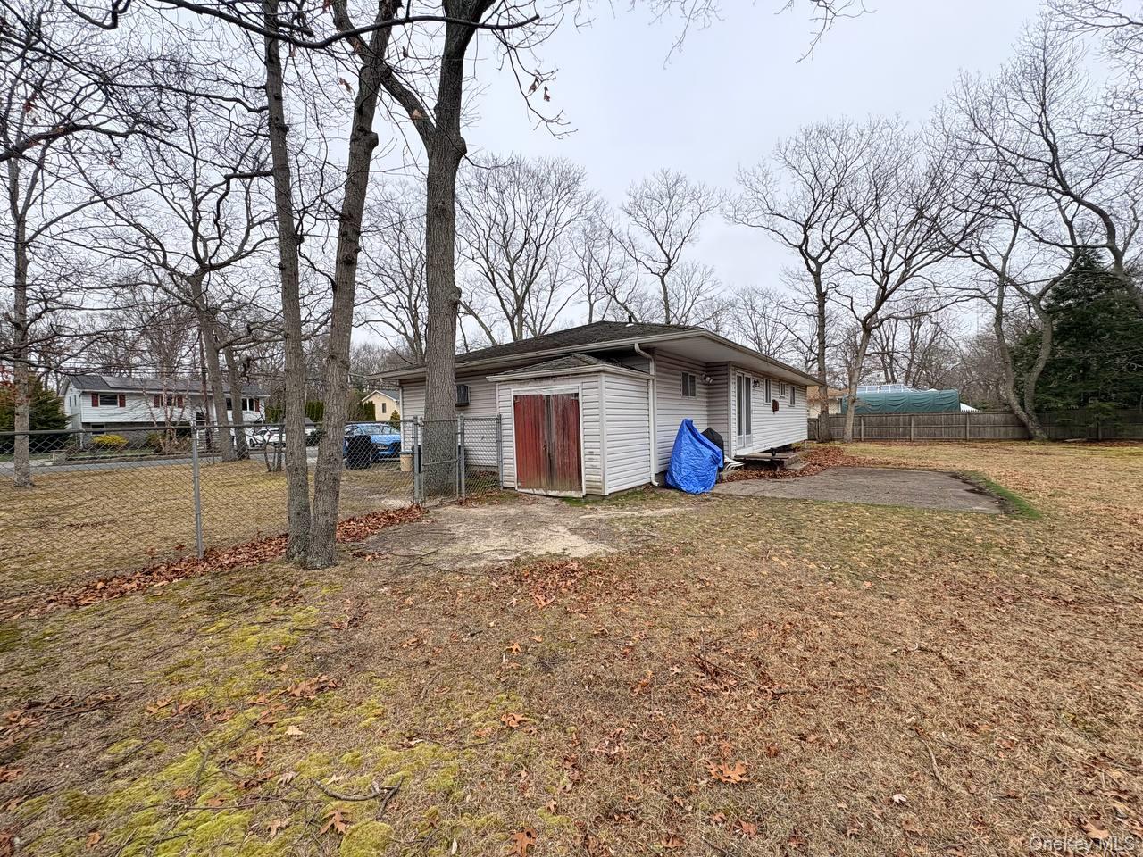 66 40th Street Islip, NY 11751 - Photo 12 of 12 a view of a yard with a house and tree