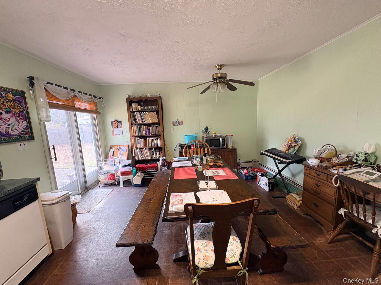 66 40th Street Islip, NY 11751 - Photo 5 of 12 a view of a workspace with furniture and a livingroom