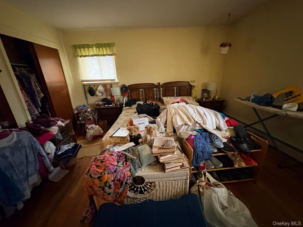66 40th Street Islip, NY 11751 - Photo 6 of 12 a bed room with two beds and a flat screen tv