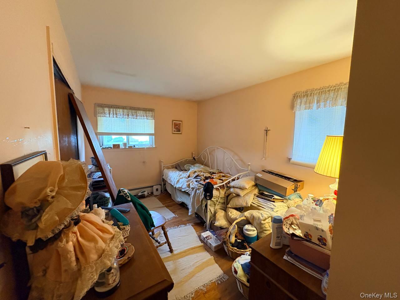 66 40th Street Islip, NY 11751 - Photo 8 of 12 a living room with furniture and a window