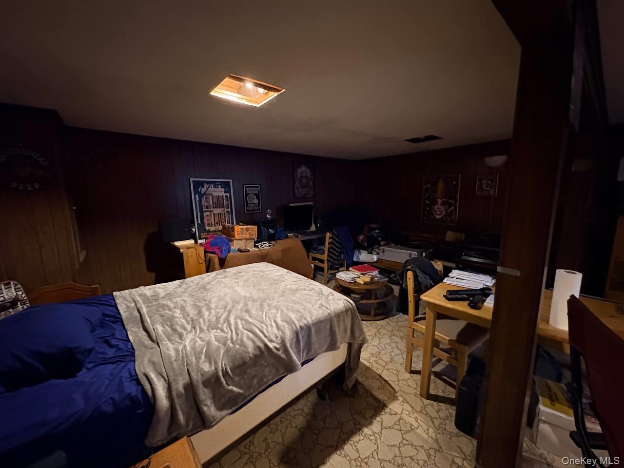 66 40th Street Islip, NY 11751 - Photo 9 of 12 a bed room with a bed and a television
