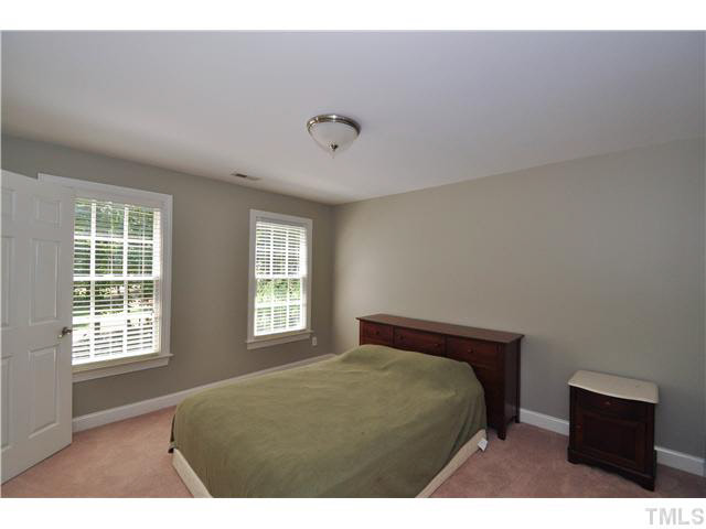 4209 White Chapel Way Raleigh, NC 27615 - Photo 15 of 25 The secondary bedrooms is perfect for guests and family alike! It features a designer color scheme, neutral carpet, smooth ceilings and walk-in closet. There is also an attached bathroom!