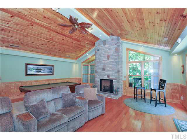 4209 White Chapel Way Raleigh, NC 27615 - Photo 17 of 25 The detached 2-car garage in-law/teen suite is the perfect place to escape without having to leave home! It features tongue and groove ceilings, upgraded fixtures, stone fireplace and designer color scheme!